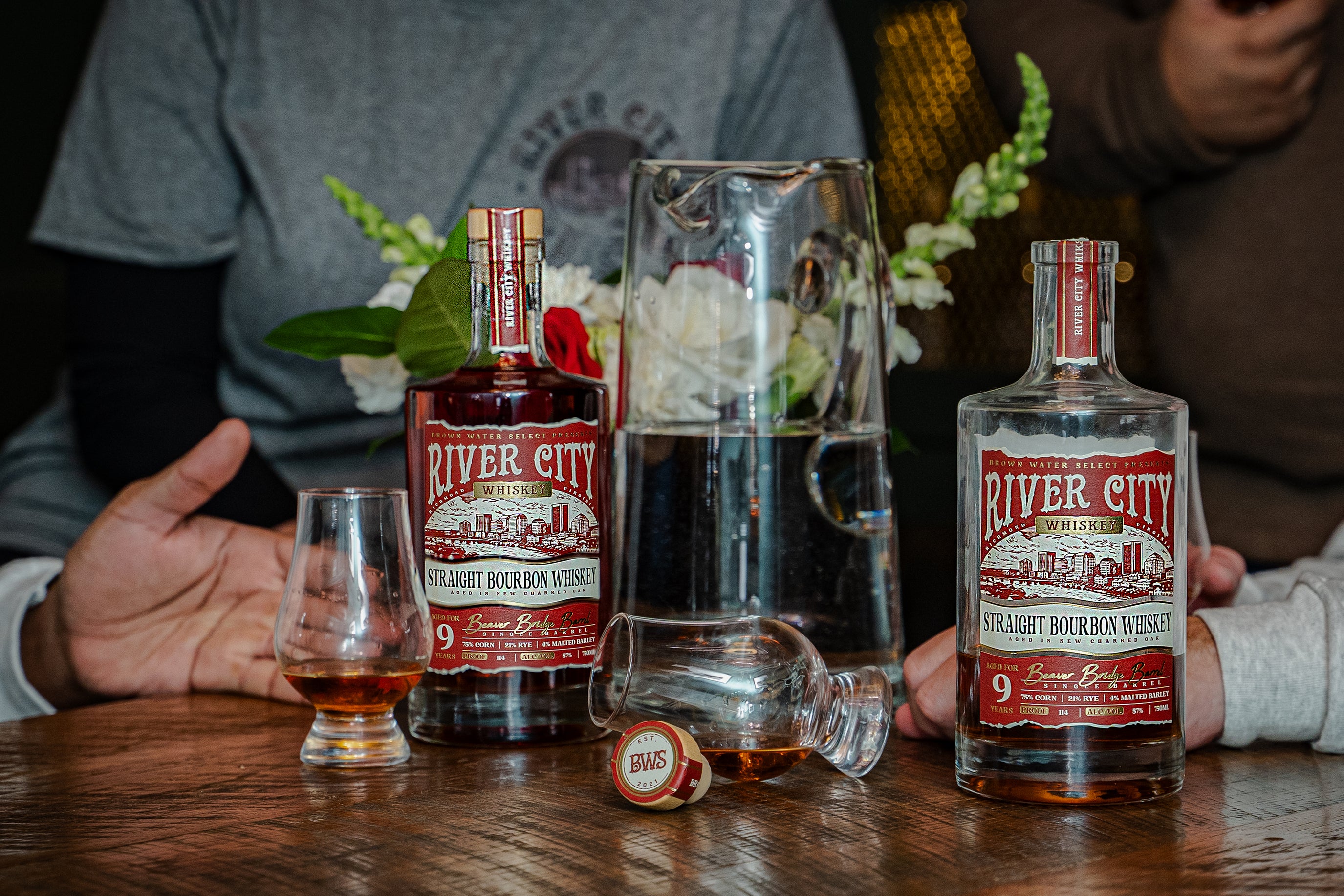 Friends enjoying conversations and pours of River City Whiskey